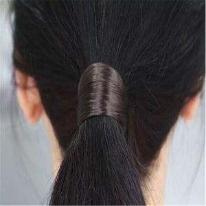 RoxyMc’s synthetic hair ponytail holder DARK BROWN